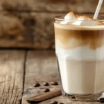A classic iced latte made with Javy Coffee Concentrate served in a tall glass with milk and ice.